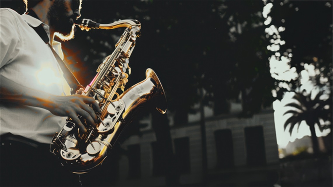 Man playing saxophone in an urban scene