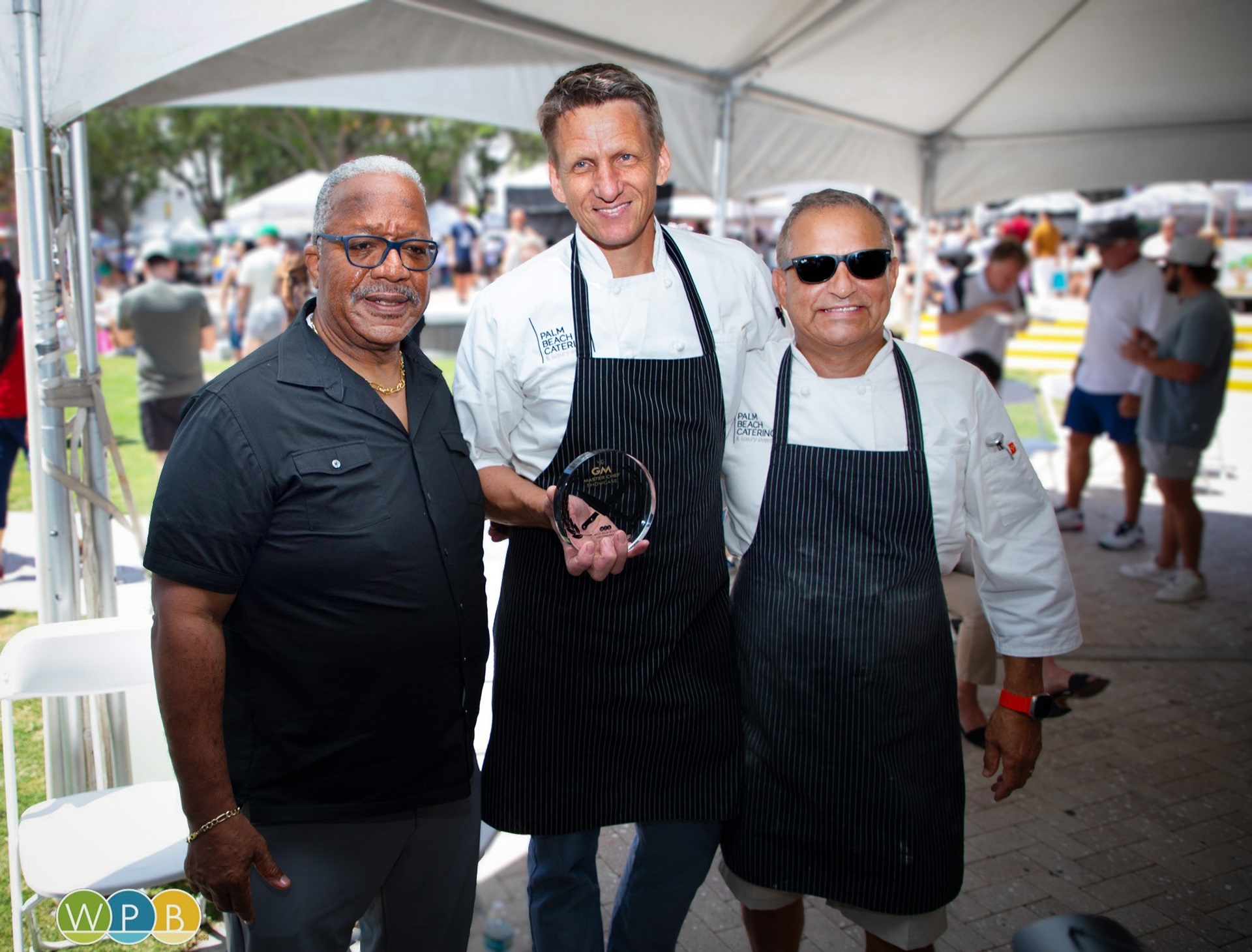 The 2025 GreenMarket Master Chefs, Joey Leuze and Sous Chef Manfred Schmidtke pose with the Mayor.