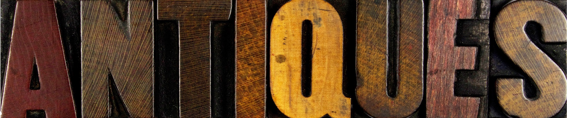 ANTIQUES in wood block letters