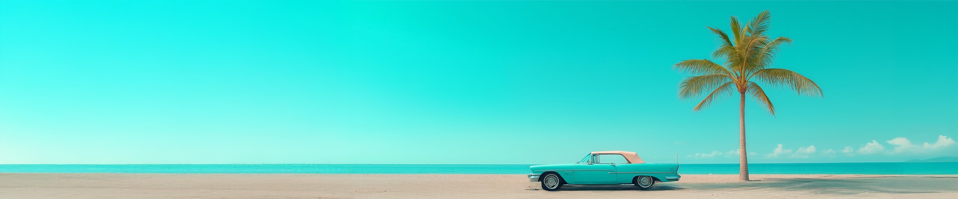 Panoramic image of a vintage car on a beach beside a single palm tree on a sunny day.