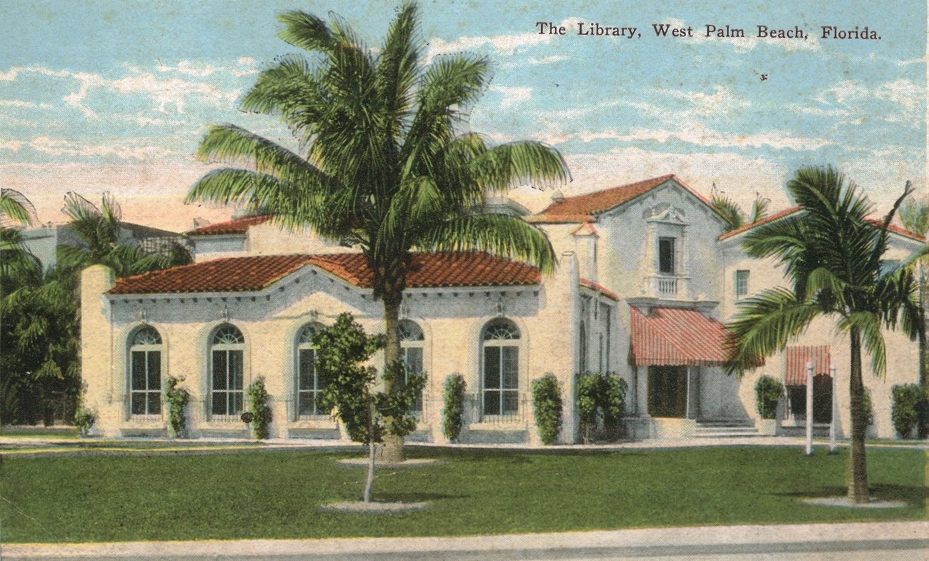 Picture of old Memorial Library building with palm tree