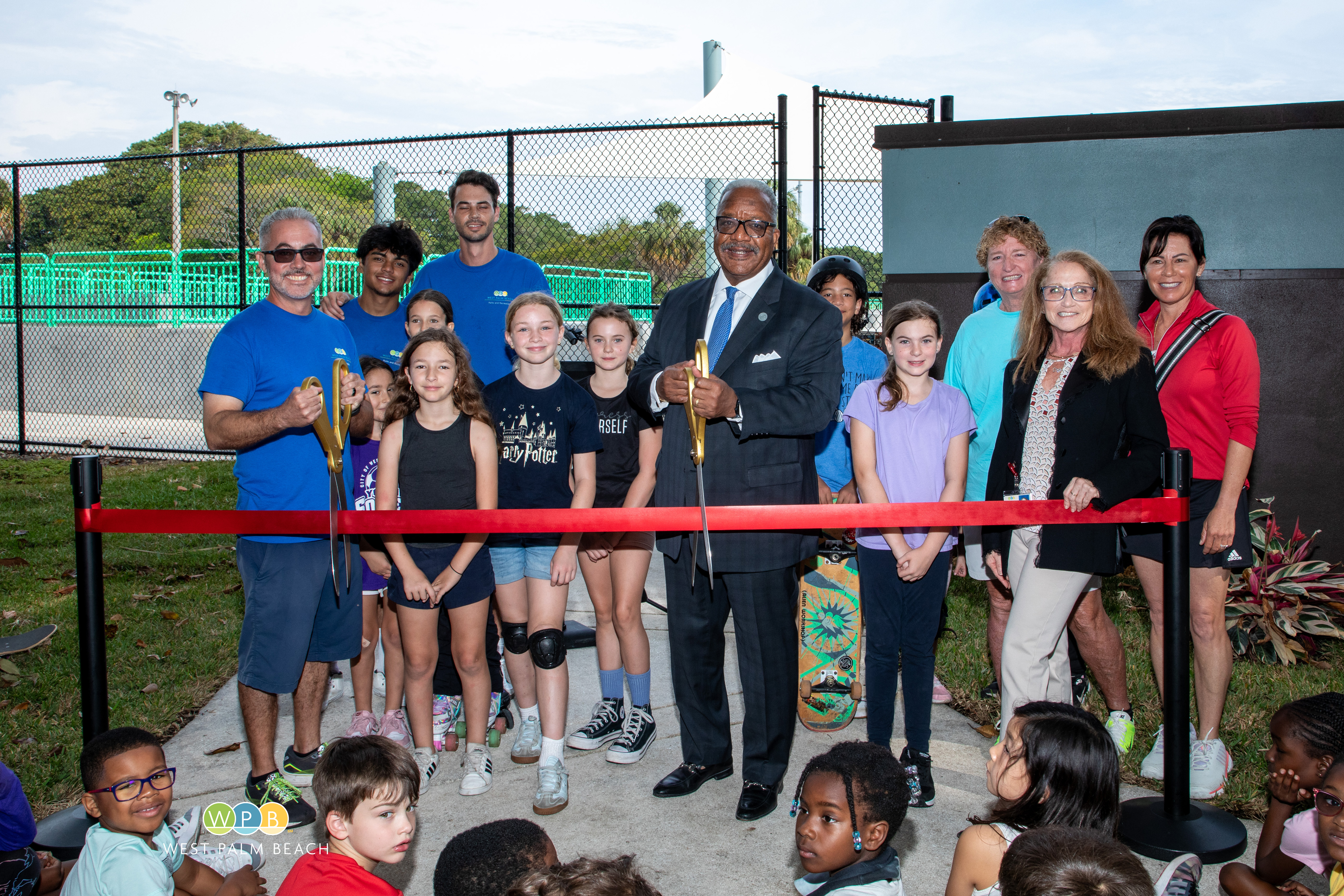 Mayor-Keith-A.-James-is-ready-to-cut-the-rubbon-to-open-the-Phipps-Park-Skate-and-Pickleball-courts.jpg