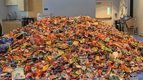 Large pile of candy wrappers