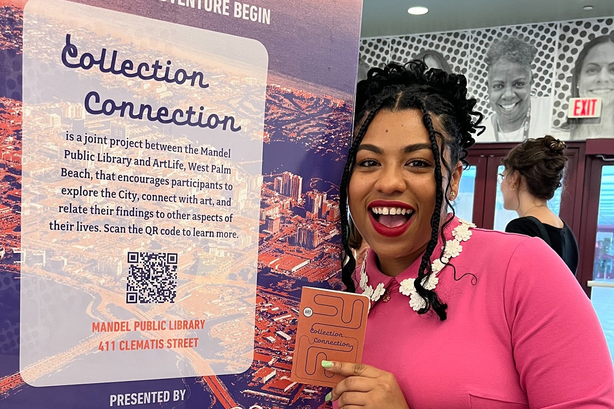 woman holding notebook in front of Collection Connection sign