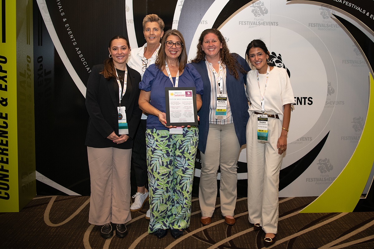 Award ceremony at FFEA, five women standing, holding certificate.
