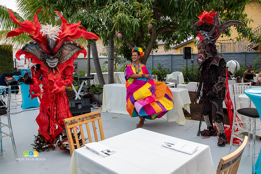 King Gremlin costumed dancers and a Panamanian dancer perform at the opening.