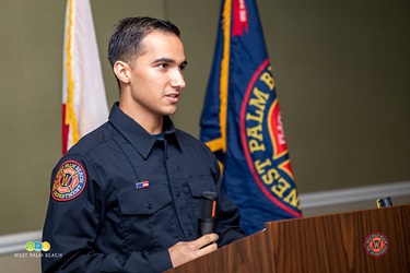 Class 25-01 spokesman Michael Truyo addresses family and friends