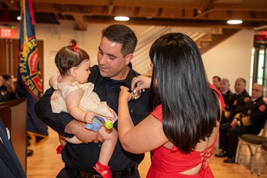 Firefighter is pinned by his wife and daughter