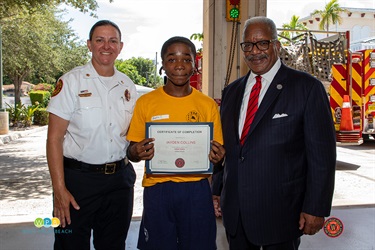 Chief Diana Matty, Junior Alert Graduate Jayden Collins and Mayor Keith A. James