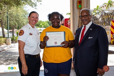 Chief Diana Matty, Junior Alert Graduate Jedah Wellington and Mayor Keith A. James