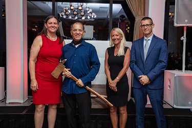 Axe presentation, four people standing