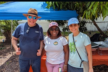 Three team members who hosted the Pleasant City Grill in the Garden