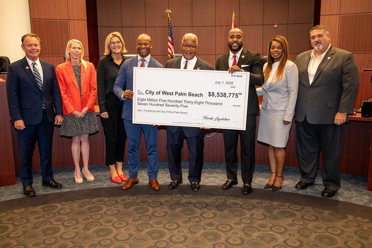 State Representative Jervonte Edmonds and State Senator Mack Bernard present the check to Mayor Keith A. James and the City Commissioners
