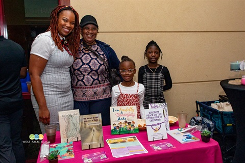 Yonique Watkins with her family and her faith-based business