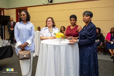 MJA Dean, Charlotte Wright, right, and ladies listen to speakers at the Sixth Cohort kickoff