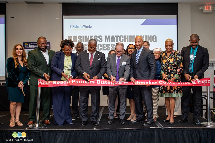 Mayor Keith A. James, cuts the ribbon along with other dignitaries