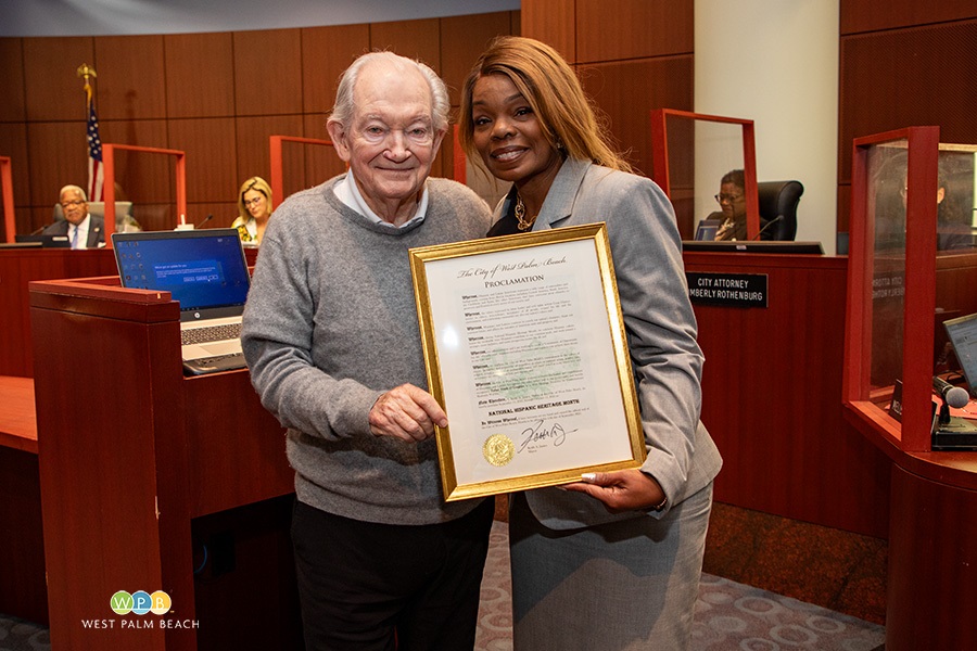 Father Frank O'Loughlin and City Commissioner Shalonda Warren