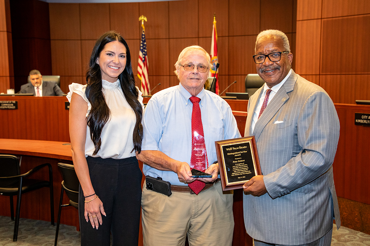 Sarah Morris of Granicus, webmaster Peter Dobens and Mayor Keith A. James