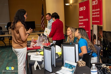 Three ladies discussing opportunities with West Construction.