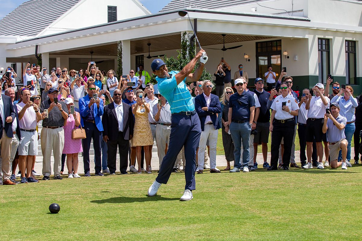 Tiger Woods hits the ceremonial first shot