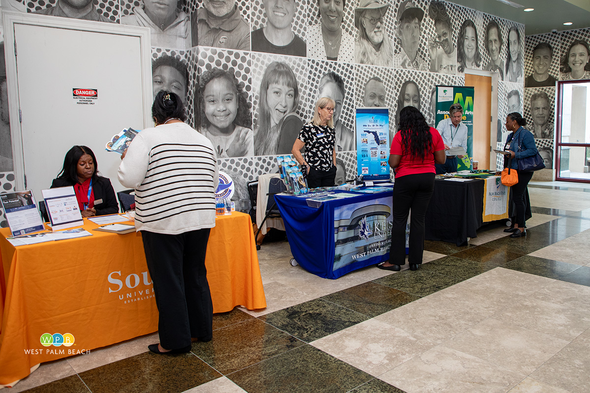 Prospective students get information from representatives from three colleges