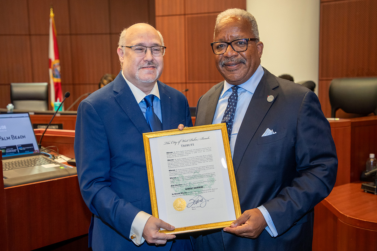 Two men standing, Robert Sanders, left, Mayor Keith A. James, right
